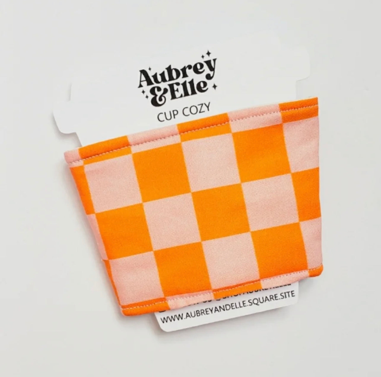 Aubrey + Elle - Pink/Orange Checkered Coffee Cozy